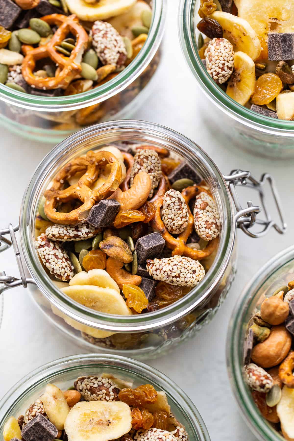 This healthy homemade trail mix is the perfect snack to satisfy all your sweet and salty cravings. Homemade trail mix in a mason jar.