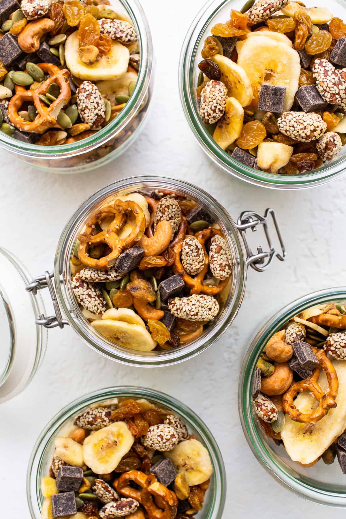 Homemade trail mix in mason jars.