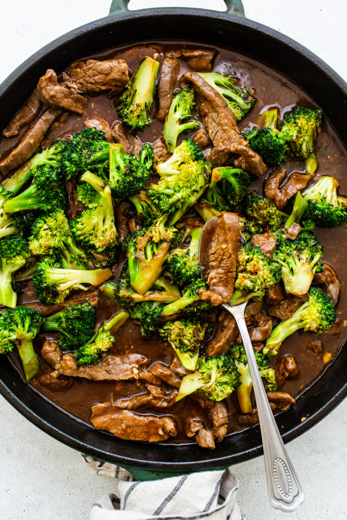 beef and broccoli in pan.