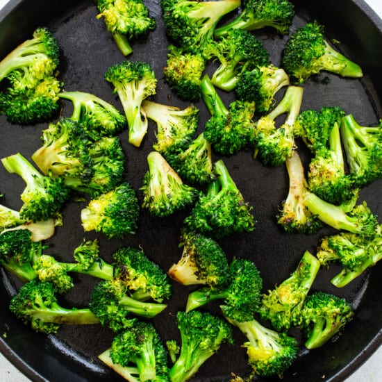 cooking broccoli in pan.