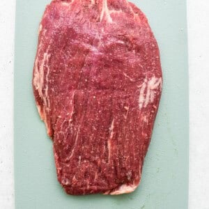 tenderized beef on cutting board.