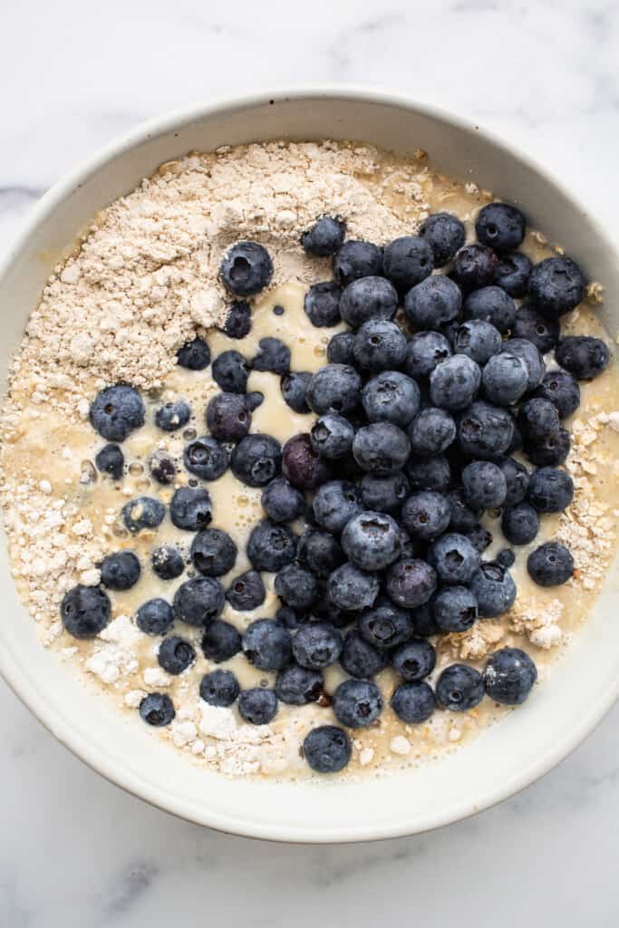 Blueberry muffin baked oatmeal batter in a bowl.