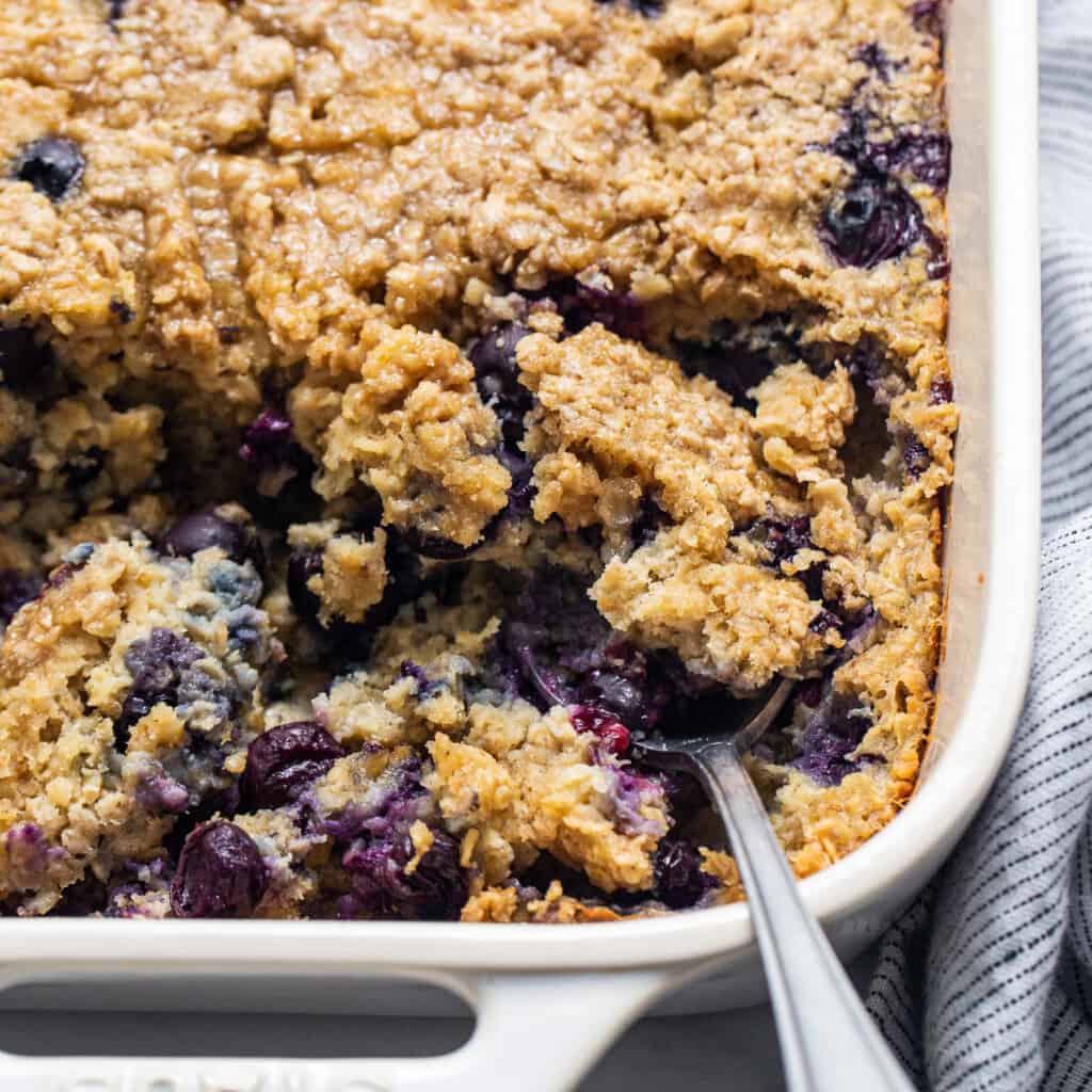 Blueberry muffin oatmeal bake in a casserole dish.