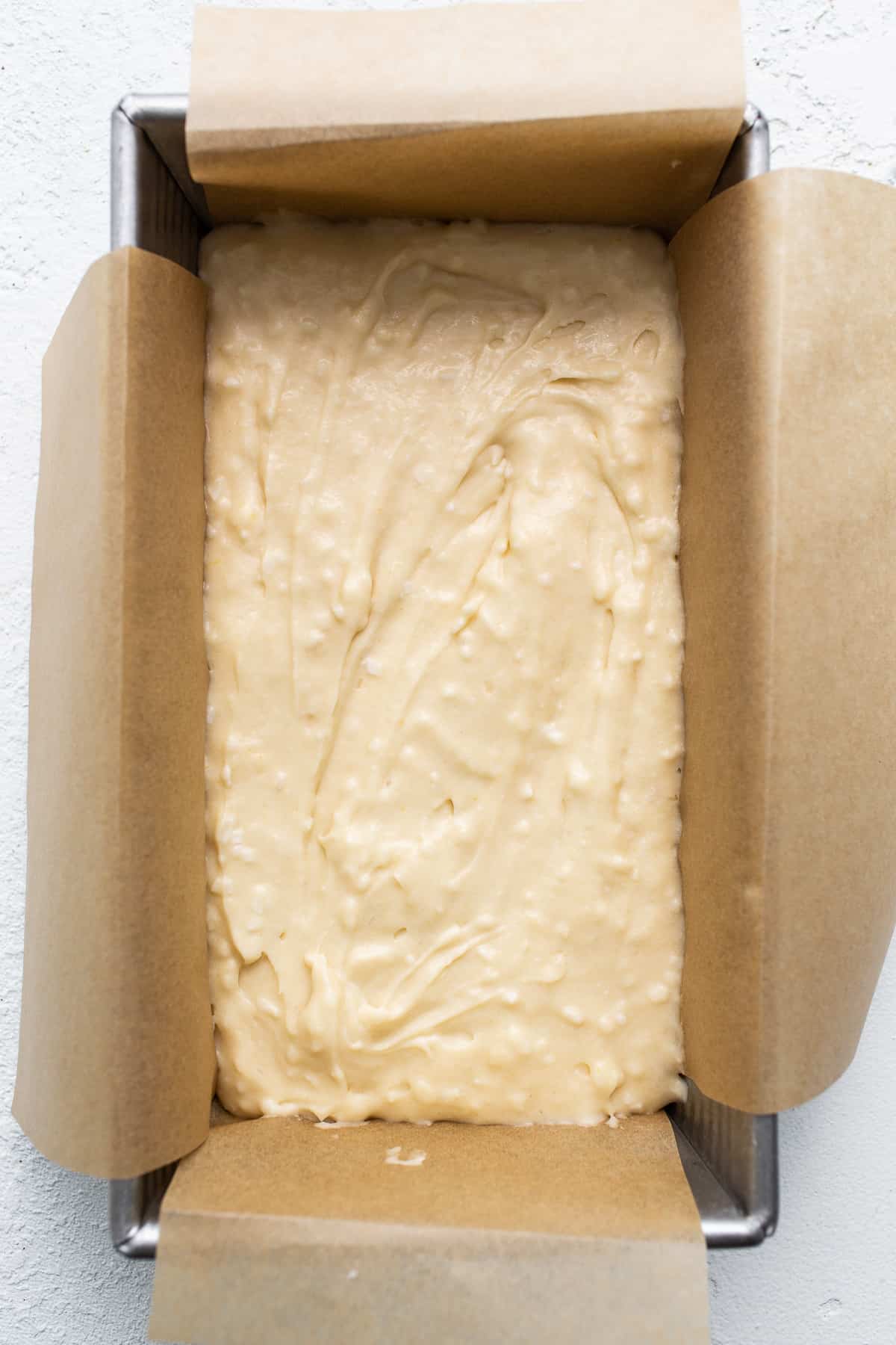 Cake batter in the loaf pan.