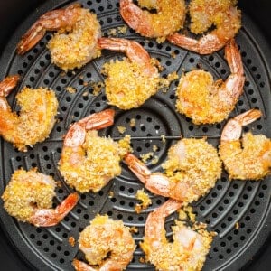 Fried shrimp in an air fryer with sesame seeds.