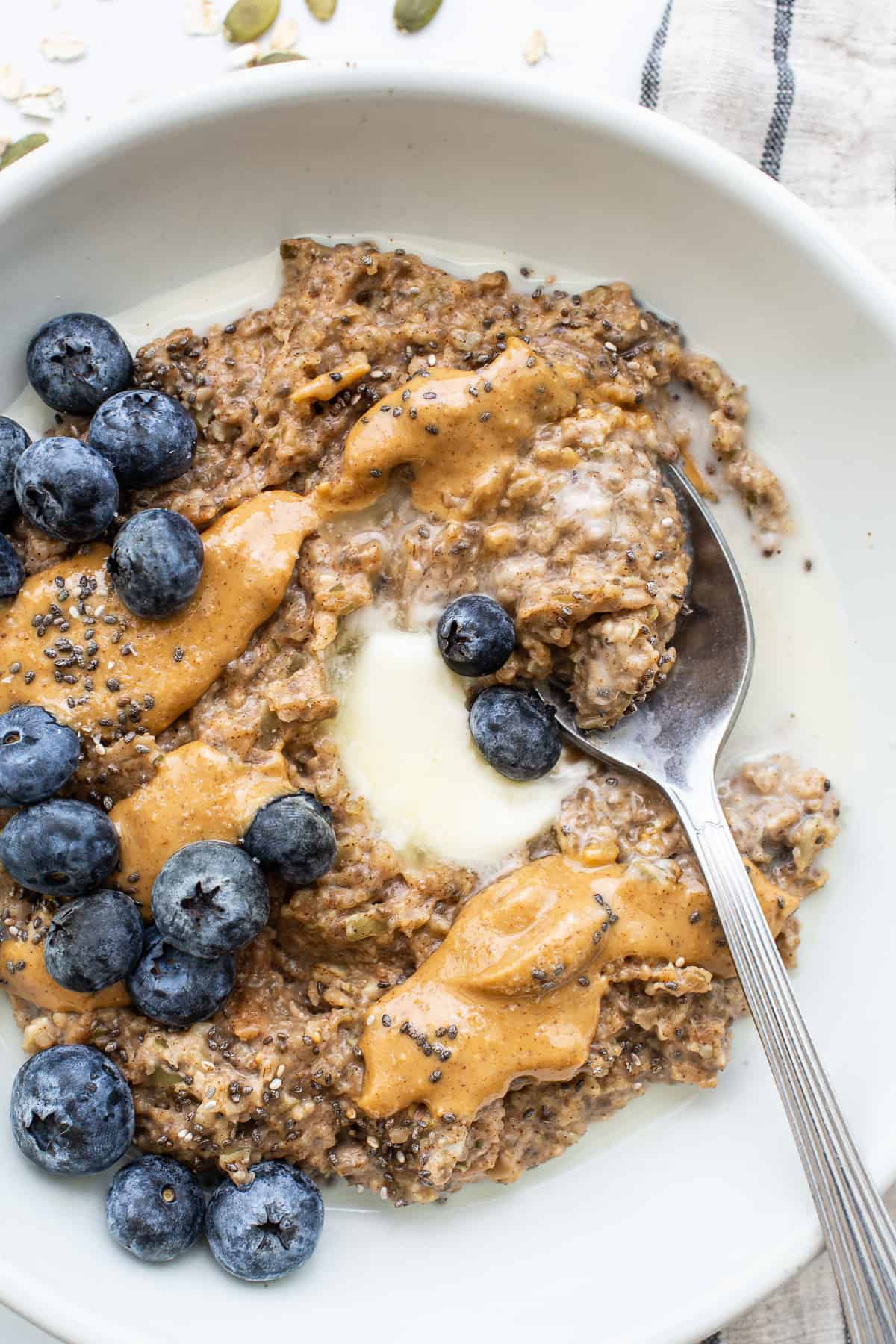 Porridge topped with nut butter and fruit. 