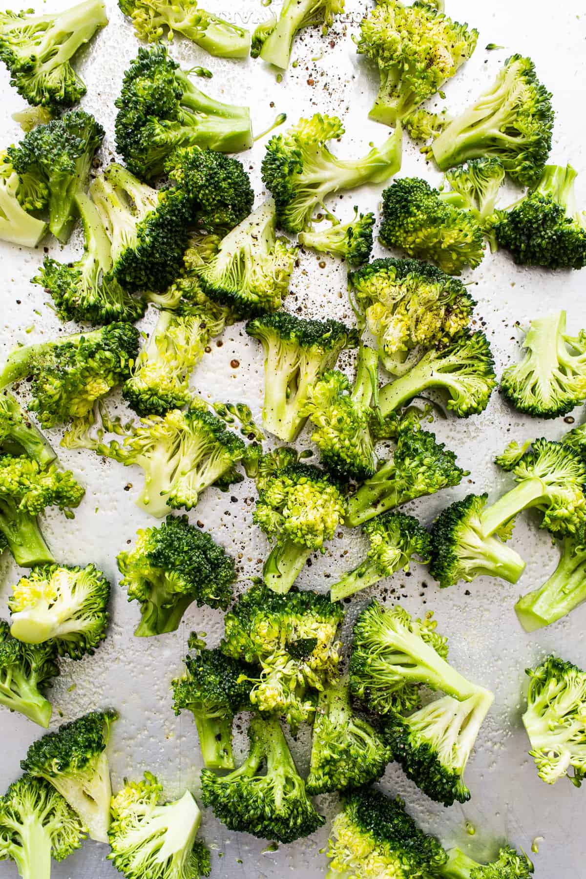 Roasted broccoli on a sheet pan.