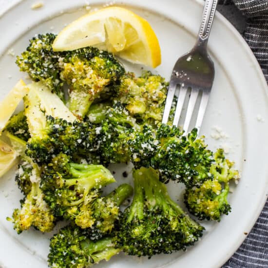 Roasted broccoli on a plate.