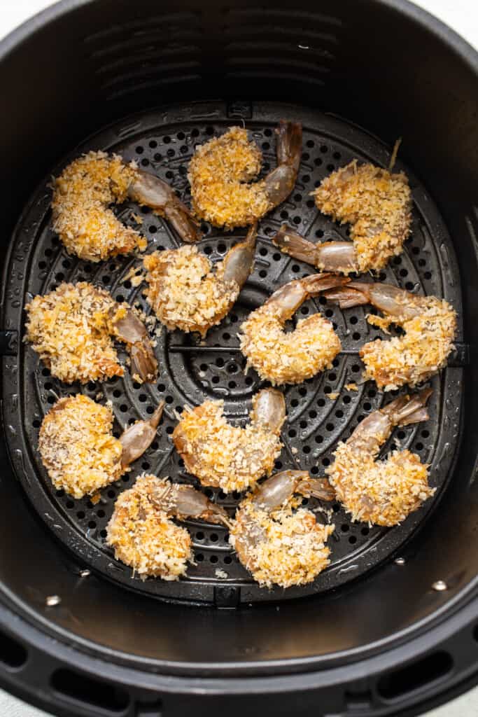 Breaded shrimp in an air fryer.