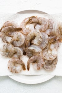 Shrimp on a white plate on a white background.