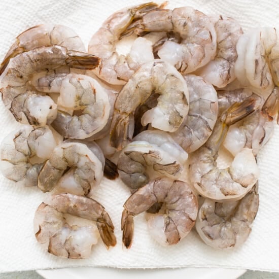 Shrimp on a white plate on a white background.