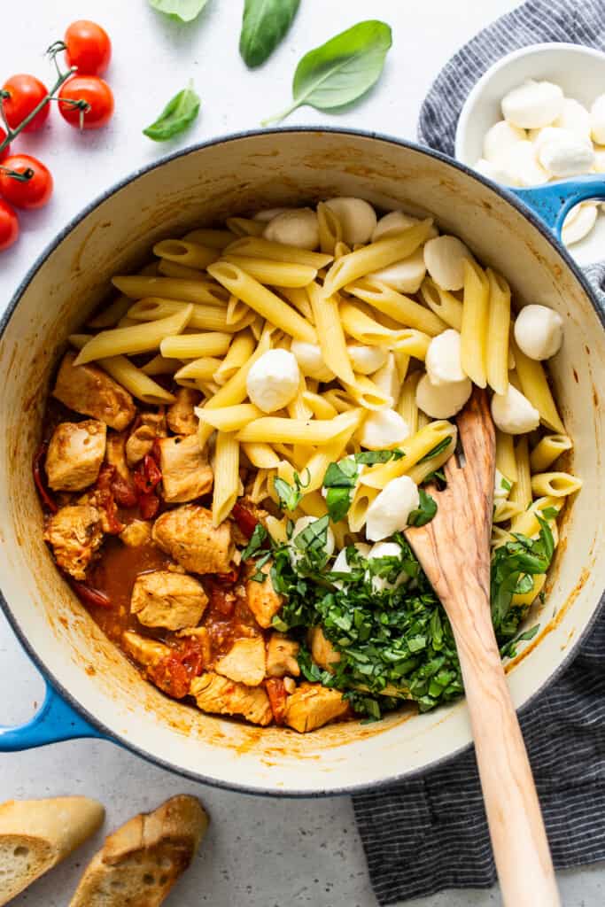 caprese chicken pasta in large pot.