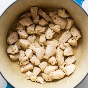 cooking chicken in pot.