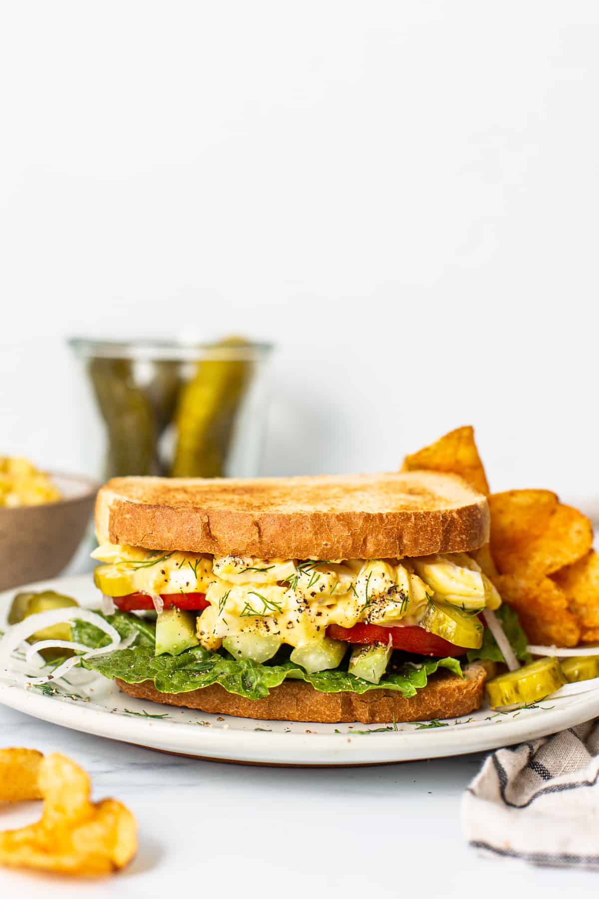 Egg salad sandwich on a plate.