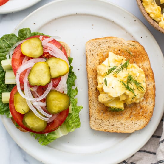 Egg salad sandwich ingredients on toast.