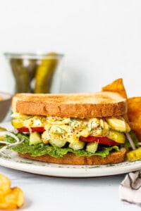 Egg salad sandwich on a plate.