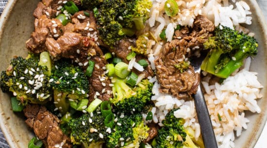 beef and broccoli with rice in bowl.