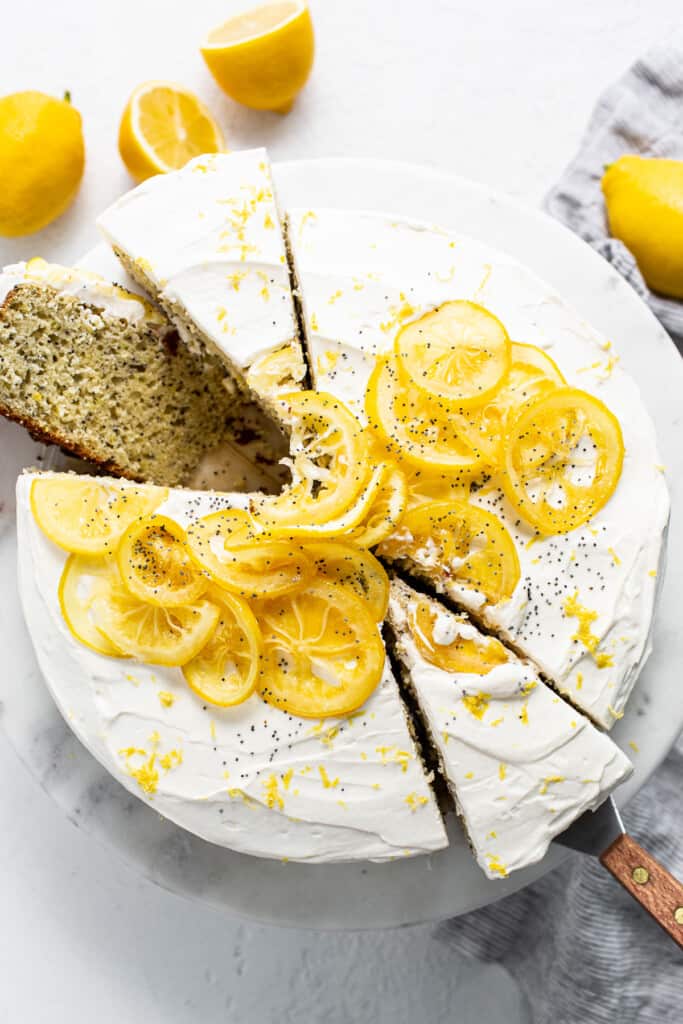 Lemon and poppy seed cake on a cake plate.