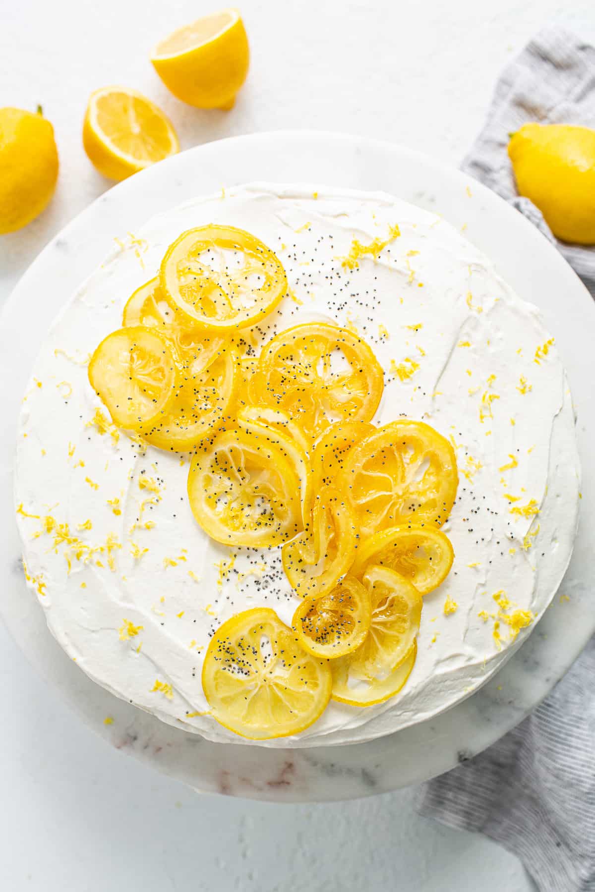 Lemon poppy seed cake topped with candied lemon slices.