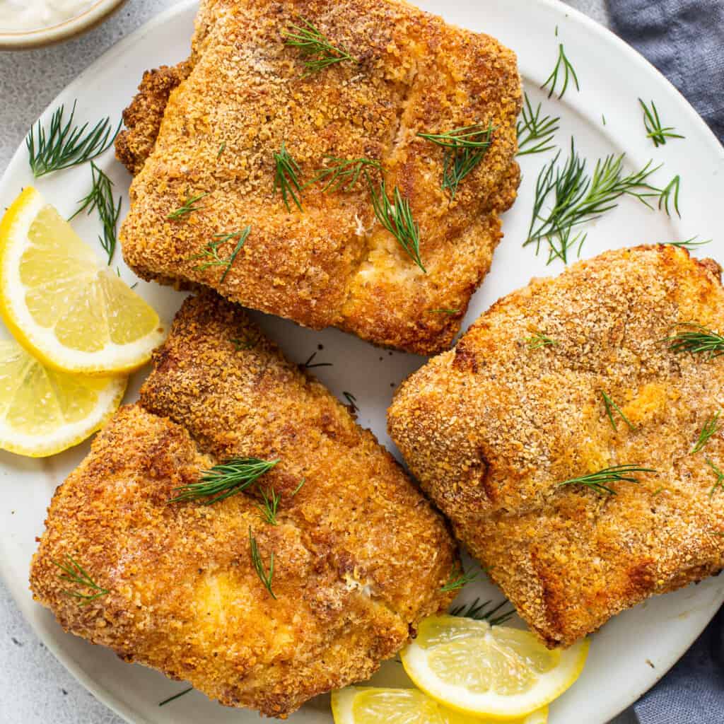 Air fryer fish on a plate.