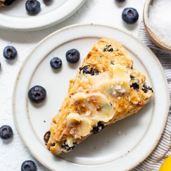 a slice of blueberry scones on a white plate.