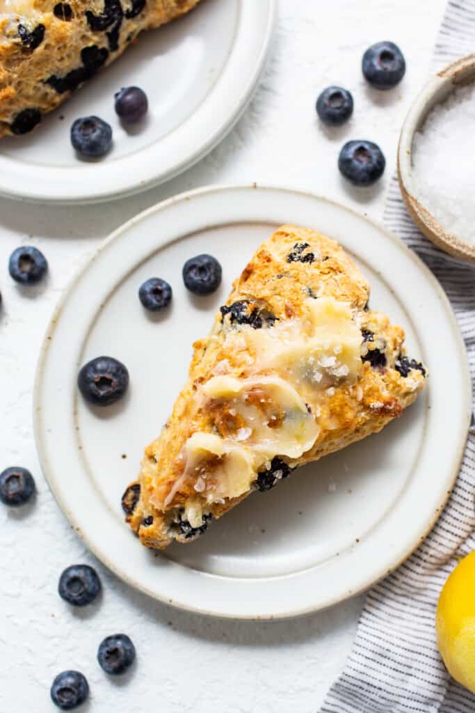 a slice of blueberry scones on a white plate.