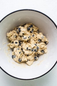 a white bowl filled with blueberries and oatmeal.