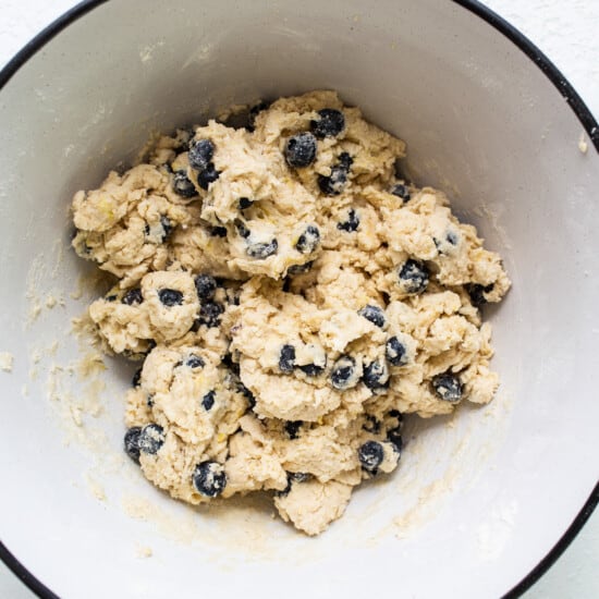 a white bowl filled with blueberries and oatmeal.