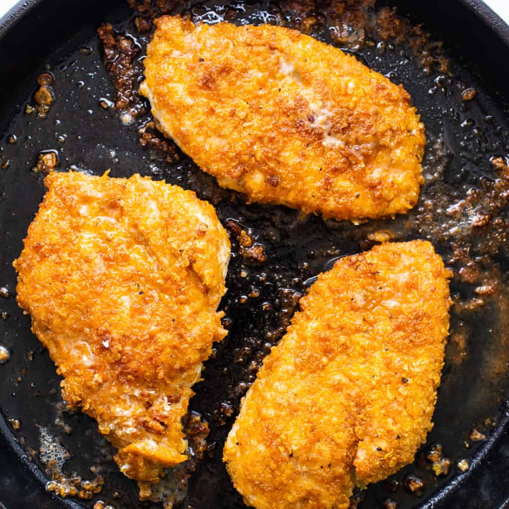 chicken breasts connected  formed  robust  pan.