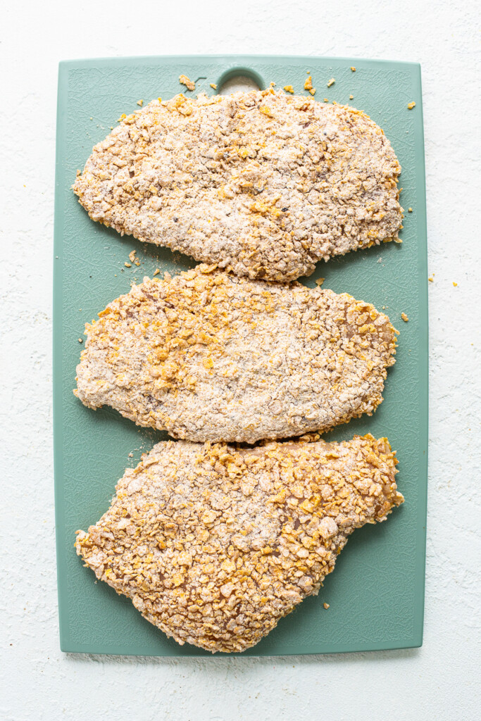 uncooked chicken on cutting board.