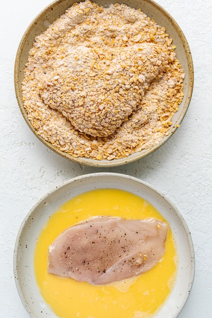 dredging chicken in egg and topping.