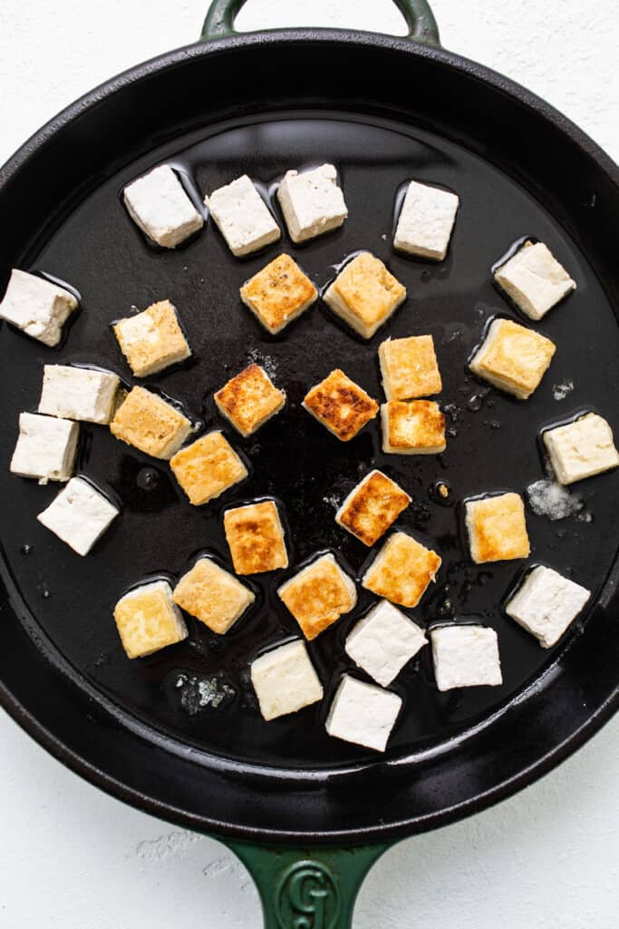 frying tofu in oil.