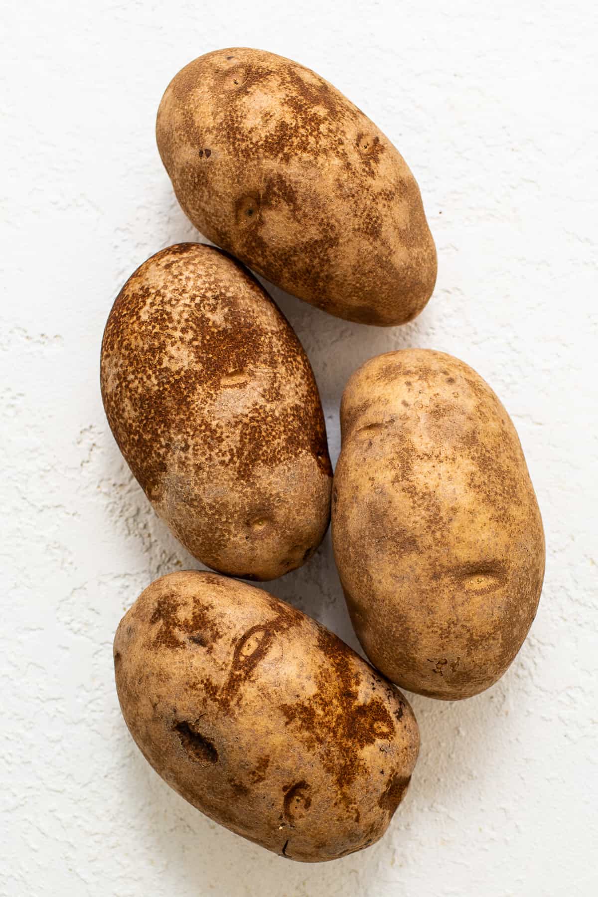 russet potatoes on countertop.