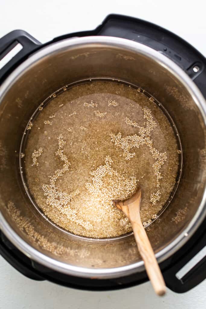 Liquid and quinoa in Instant Pot.