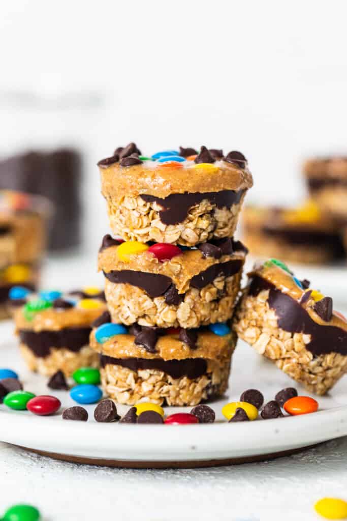 Monster Cookie oat cups stacked on top of each other.