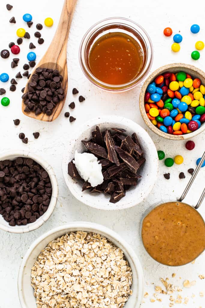 Ingredients for monster cookie oat cups in bowls.