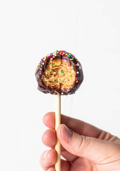 A protein cake pop with a bite out of it.