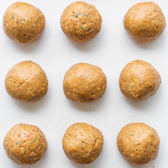 Protein cake pop balls on a cookie sheet.