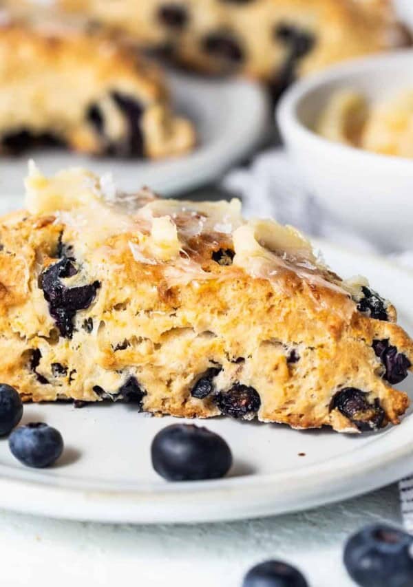a close up of a plate of blueberry scones.