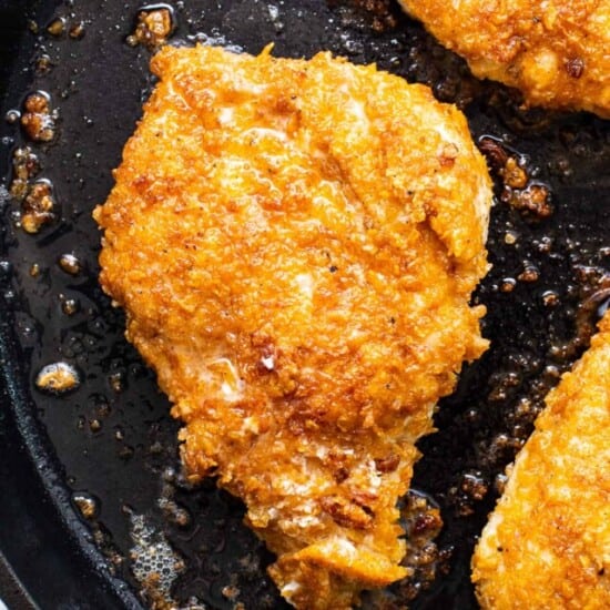 cooking chicken in pan.