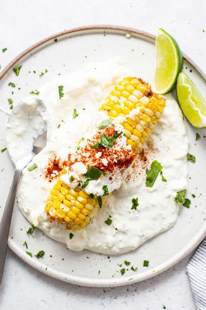 Air fryer elote on a plate.