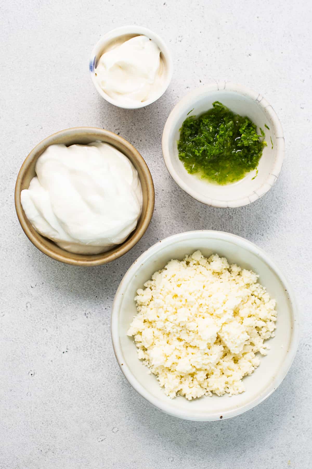 Ingredients for air fryer elote in bowls.