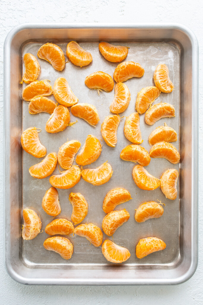 clementines on baking sheet.