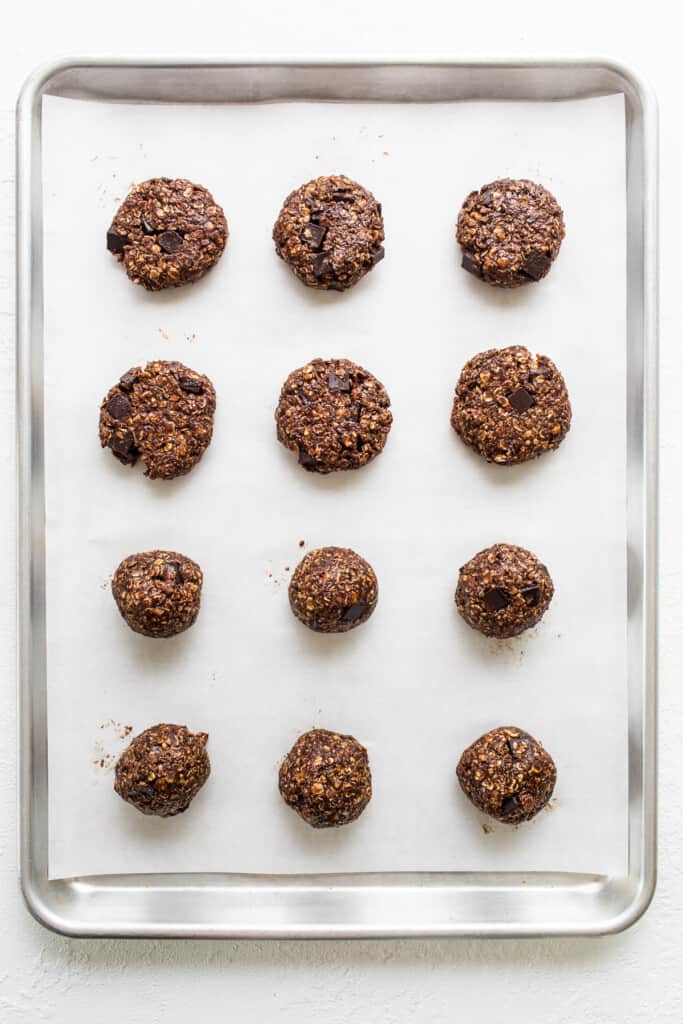 Chocolate oatmeal cookies on a baking sheet.