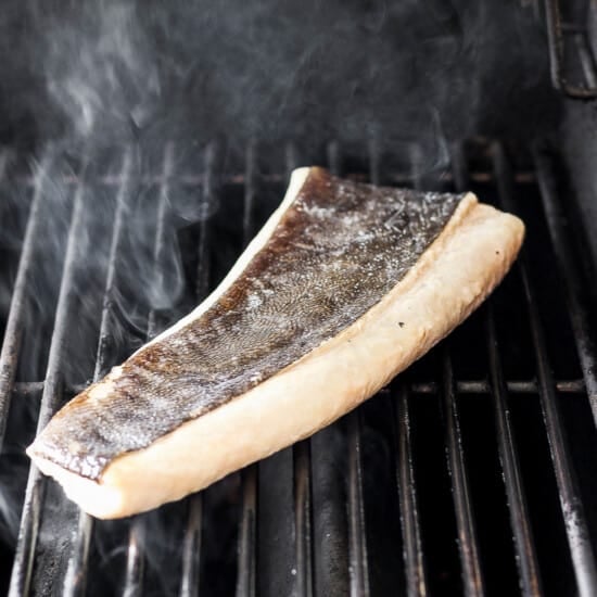 Filet of fish on a grill.