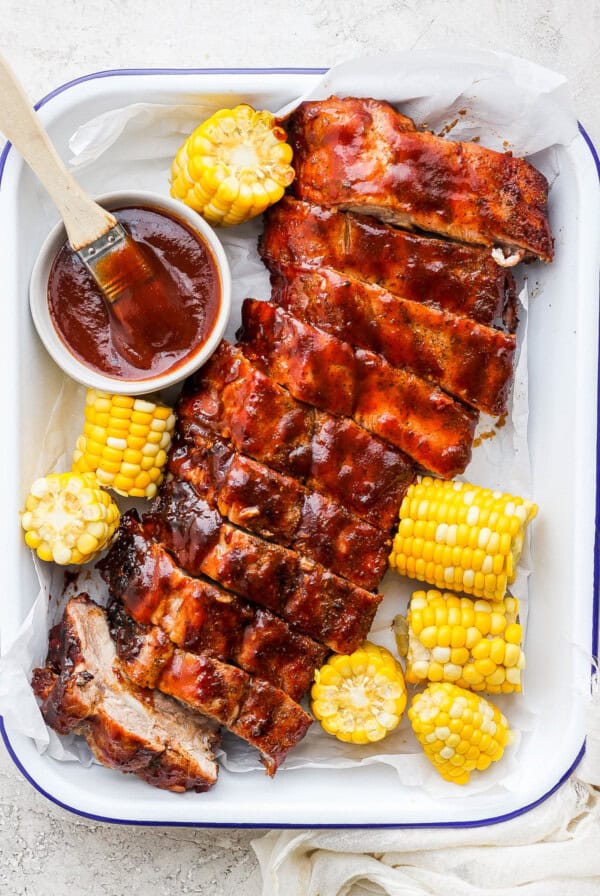 Grilled ribs and corn with bbq sauce.