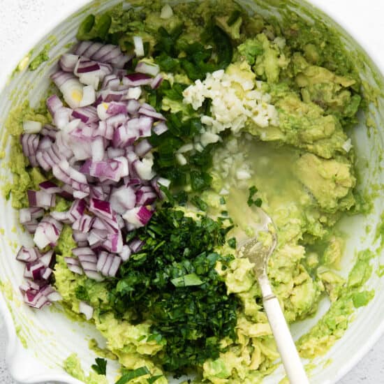 guacamole ingredients in bowl.
