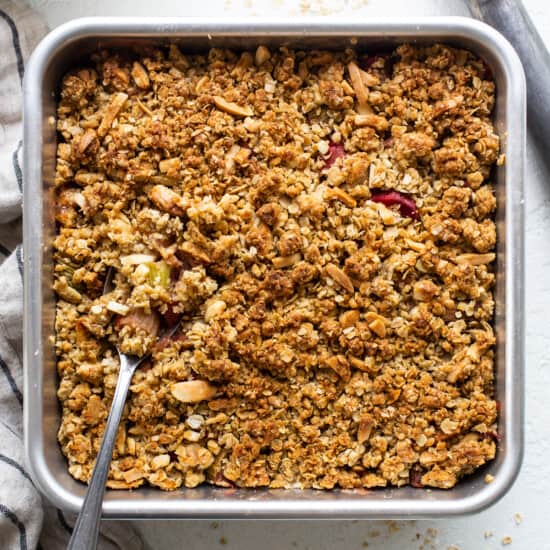 A baking dish filled with granola and fruit.