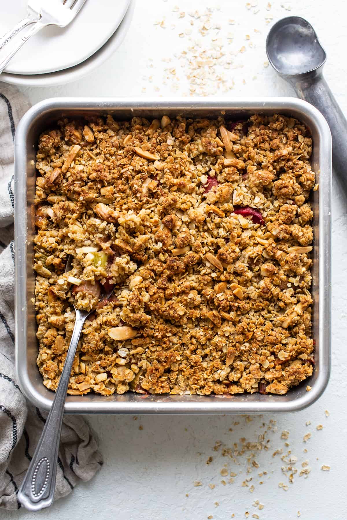 A baking dish filled with granola and fruit.