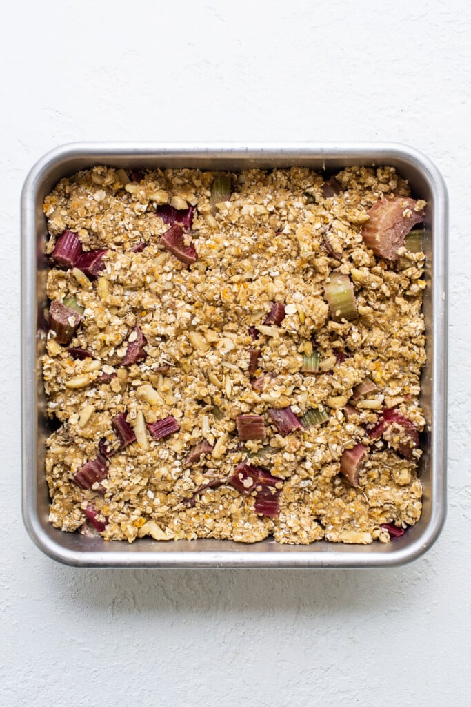 A metal pan with granola in it.